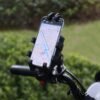 gvc.product.image_.1775494436084.e3b3a873-123d-44fa-a8be-603ac708e09b.jpeg Support Téléphone Moto/Vélo Anti-Choc – Rotation 360° – Fixation Guidon Stable – Protection Caméra